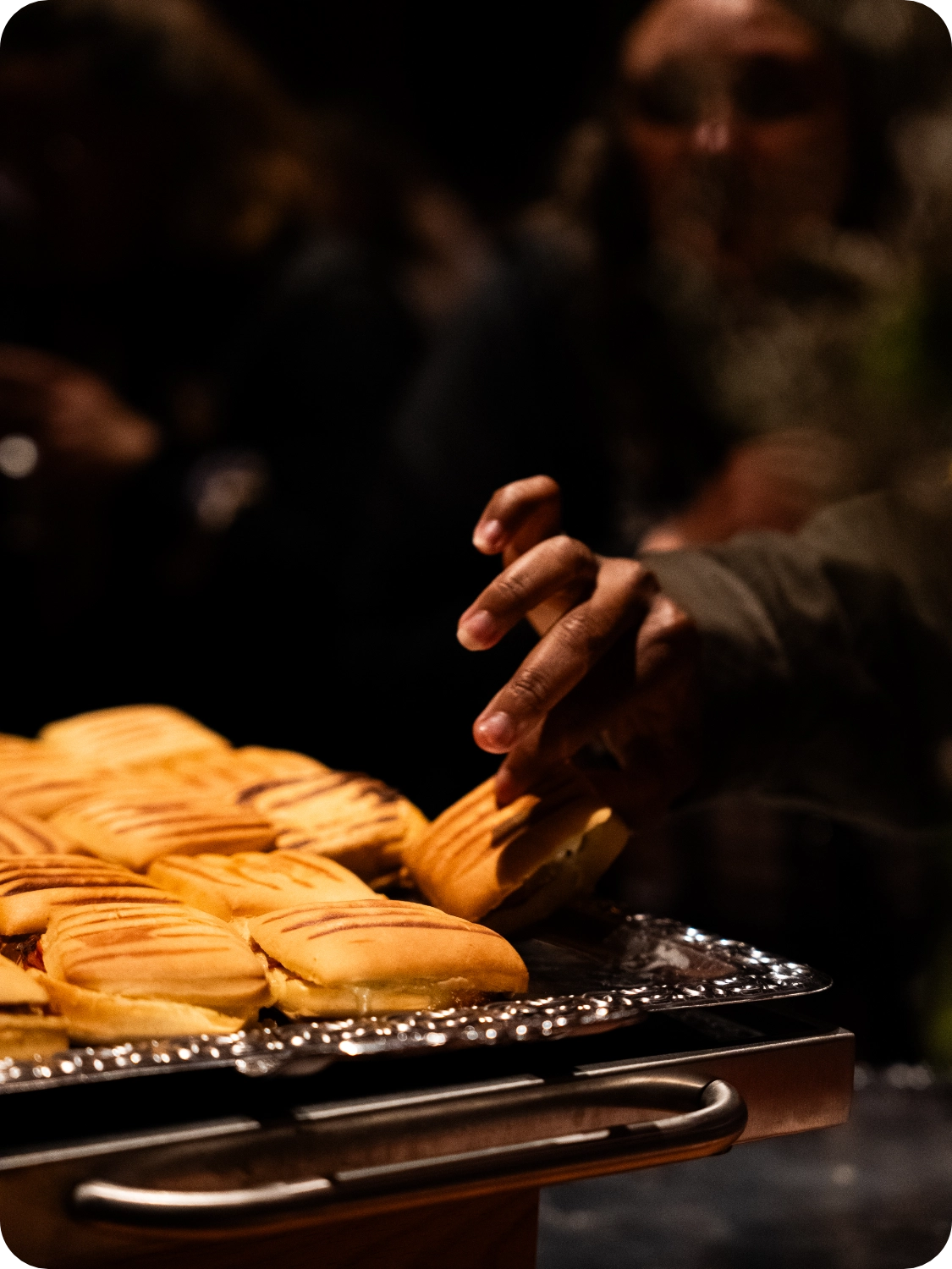 Tray of small grilled sandwiches.
